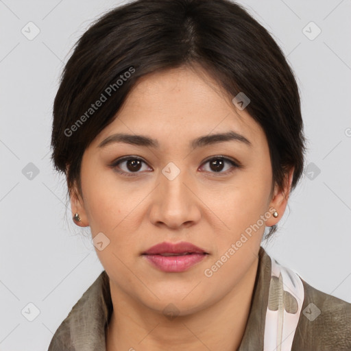 Joyful latino young-adult female with medium  brown hair and brown eyes