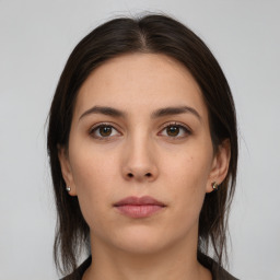 Neutral white young-adult female with medium  brown hair and brown eyes