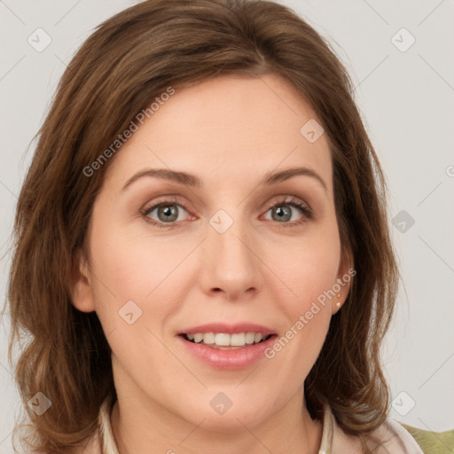 Joyful white young-adult female with medium  brown hair and green eyes