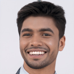 Joyful white young-adult male with short  black hair and brown eyes