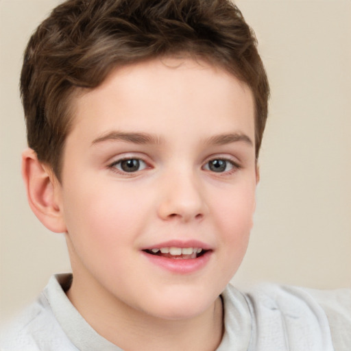 Joyful white child male with short  brown hair and brown eyes