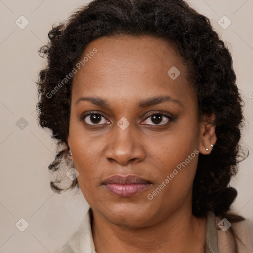 Neutral black young-adult female with medium  brown hair and brown eyes