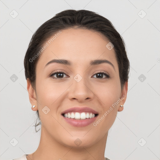 Joyful white young-adult female with short  brown hair and brown eyes