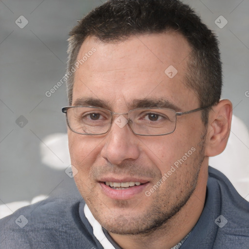 Joyful white adult male with short  brown hair and brown eyes