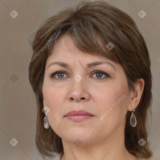 Joyful white adult female with medium  brown hair and grey eyes