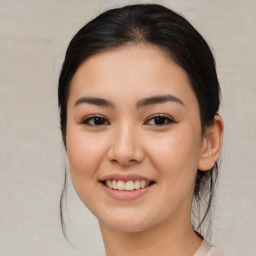 Joyful asian young-adult female with medium  brown hair and brown eyes