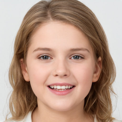 Joyful white child female with medium  brown hair and brown eyes