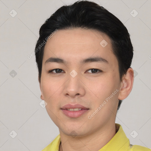 Joyful asian young-adult male with short  black hair and brown eyes