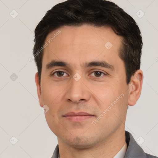 Joyful white adult male with short  brown hair and brown eyes