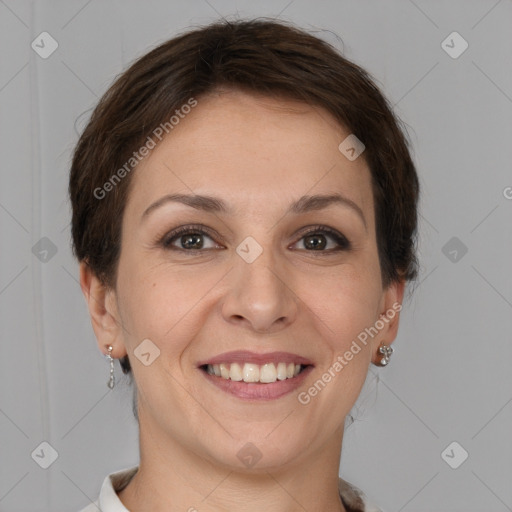 Joyful white young-adult female with short  brown hair and grey eyes