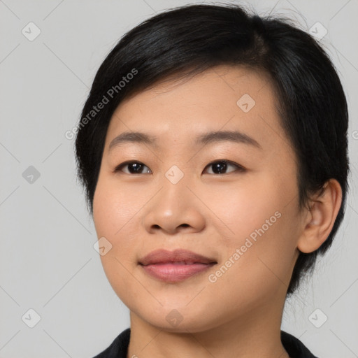 Joyful asian young-adult female with medium  black hair and brown eyes