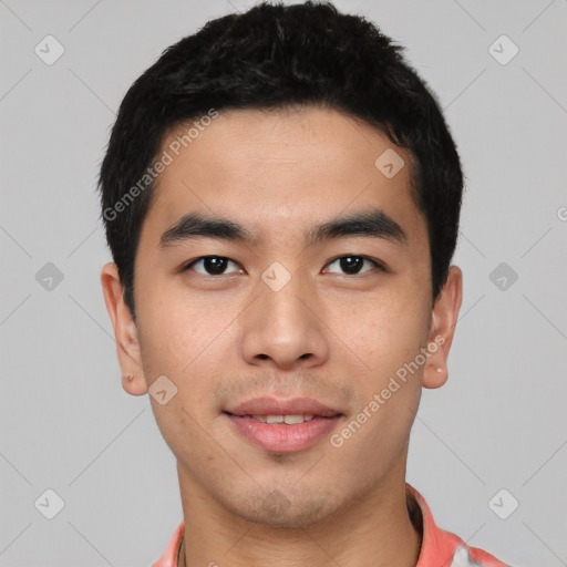 Joyful asian young-adult male with short  black hair and brown eyes