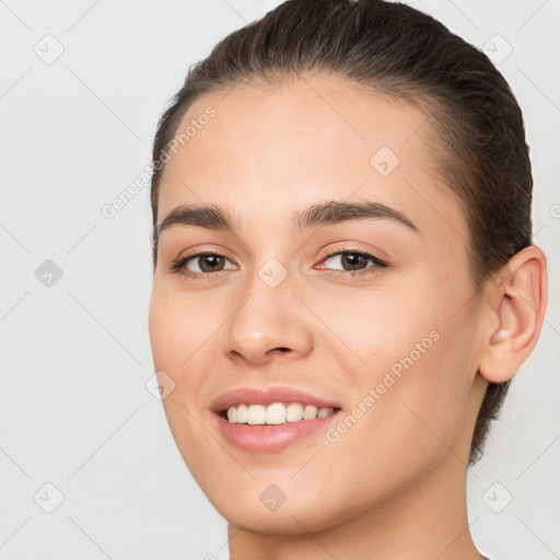 Joyful white young-adult female with long  brown hair and brown eyes