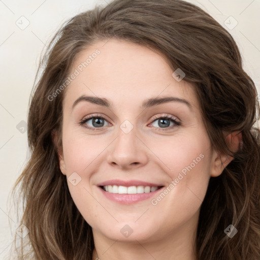 Joyful white young-adult female with long  brown hair and green eyes