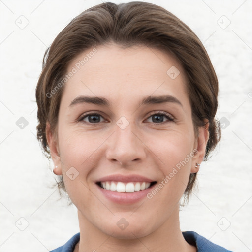 Joyful white young-adult female with short  brown hair and grey eyes