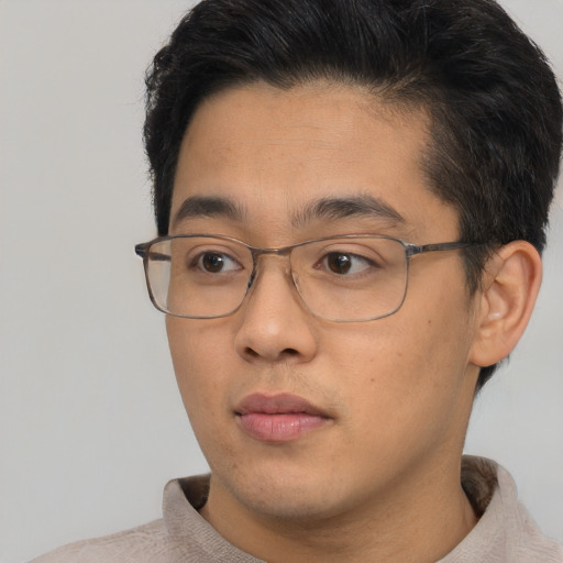 Neutral asian young-adult male with short  brown hair and brown eyes