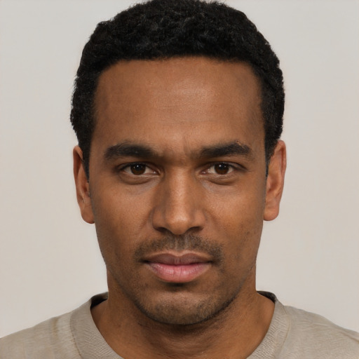 Neutral black young-adult male with short  black hair and brown eyes