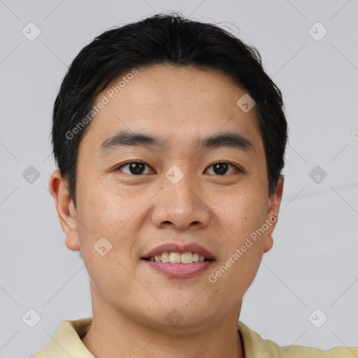 Joyful asian young-adult male with short  brown hair and brown eyes