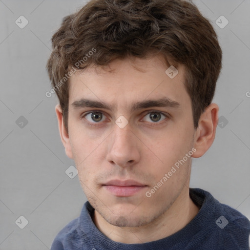 Neutral white young-adult male with short  brown hair and grey eyes