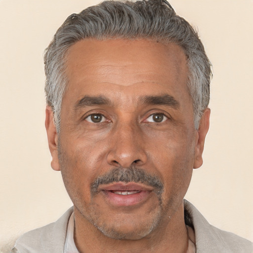 Neutral white middle-aged male with short  gray hair and brown eyes