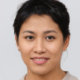 Joyful asian young-adult female with short  brown hair and brown eyes