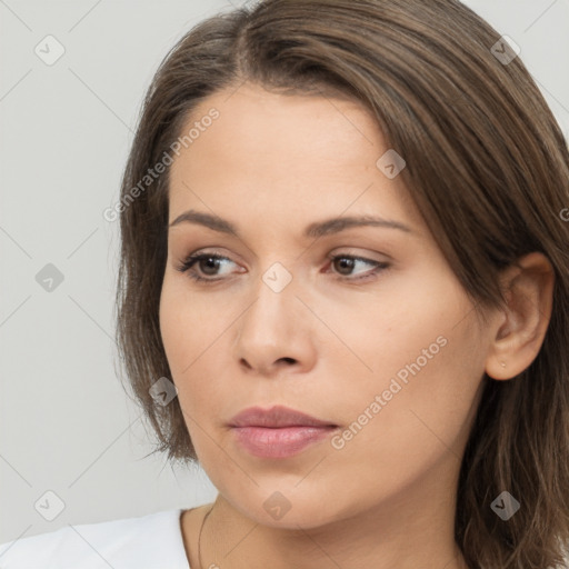 Neutral white young-adult female with long  brown hair and brown eyes