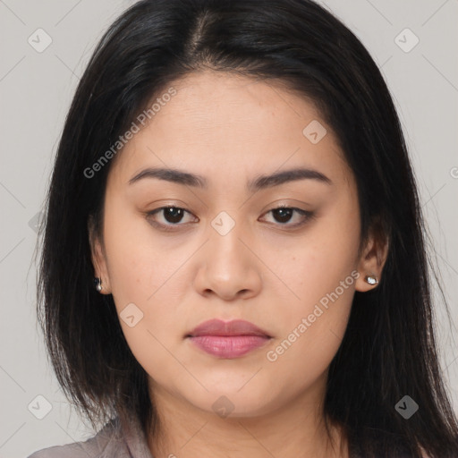 Joyful asian young-adult female with long  brown hair and brown eyes