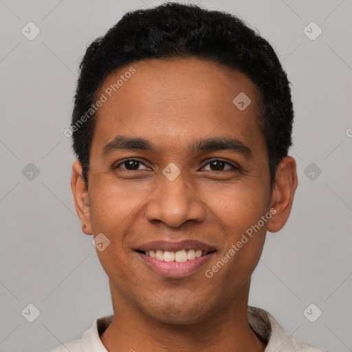 Joyful latino young-adult male with short  black hair and brown eyes