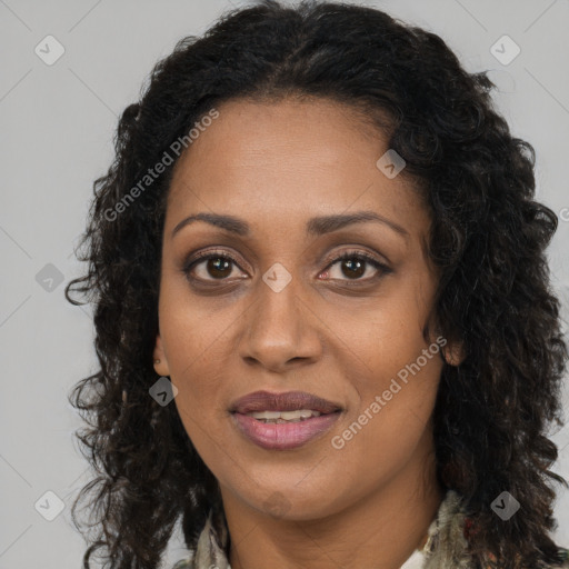 Joyful black young-adult female with long  brown hair and brown eyes