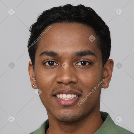 Joyful black young-adult male with short  black hair and brown eyes