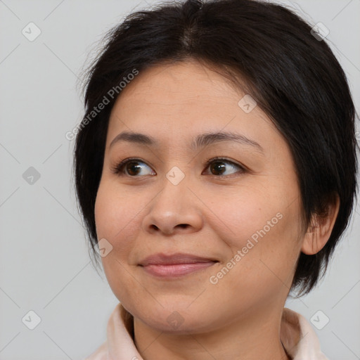 Joyful asian young-adult female with medium  brown hair and brown eyes