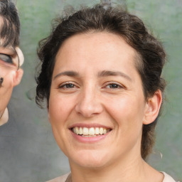 Joyful white adult female with short  brown hair and brown eyes