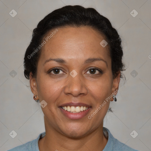 Joyful black adult female with medium  brown hair and brown eyes