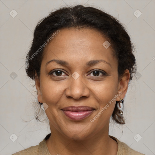 Joyful black adult female with medium  brown hair and brown eyes