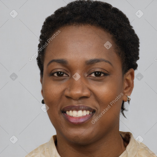 Joyful black young-adult female with short  black hair and brown eyes