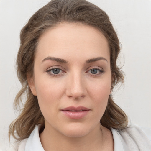 Neutral white young-adult female with medium  brown hair and grey eyes