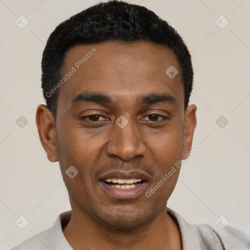 Joyful black young-adult male with short  black hair and brown eyes