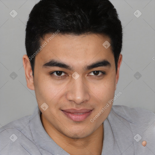 Joyful latino young-adult male with short  black hair and brown eyes