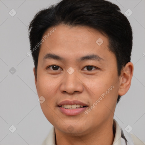 Joyful asian young-adult male with short  brown hair and brown eyes