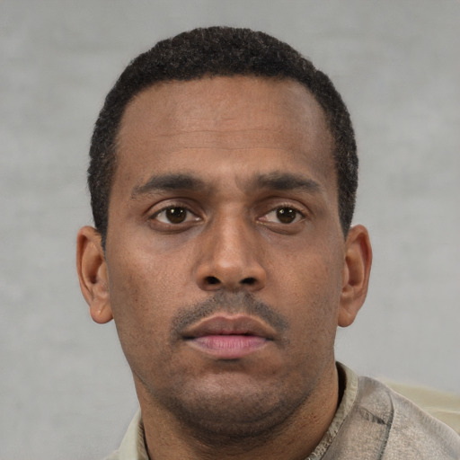 Neutral latino young-adult male with short  brown hair and brown eyes