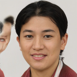 Joyful asian young-adult female with short  brown hair and brown eyes