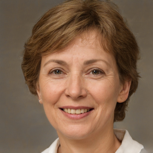 Joyful white middle-aged female with medium  brown hair and brown eyes