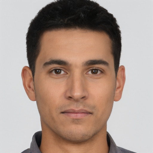 Neutral latino young-adult male with short  black hair and brown eyes