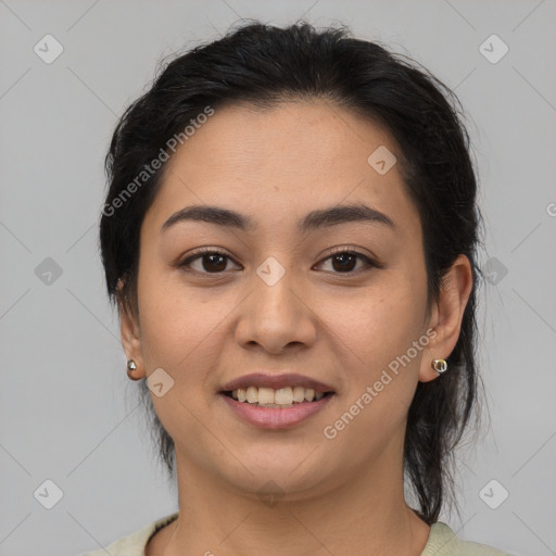 Joyful asian young-adult female with medium  brown hair and brown eyes