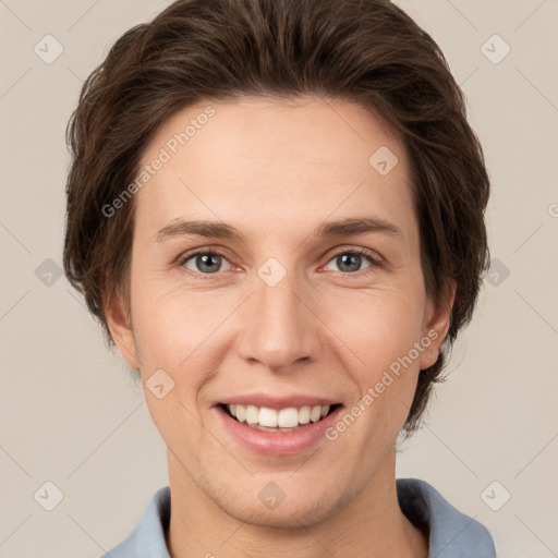 Joyful white young-adult female with short  brown hair and grey eyes