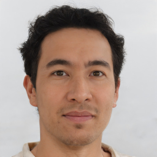 Joyful asian young-adult male with short  brown hair and brown eyes