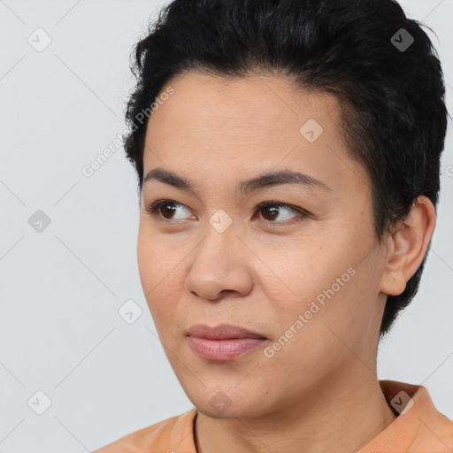 Joyful asian young-adult female with short  black hair and brown eyes