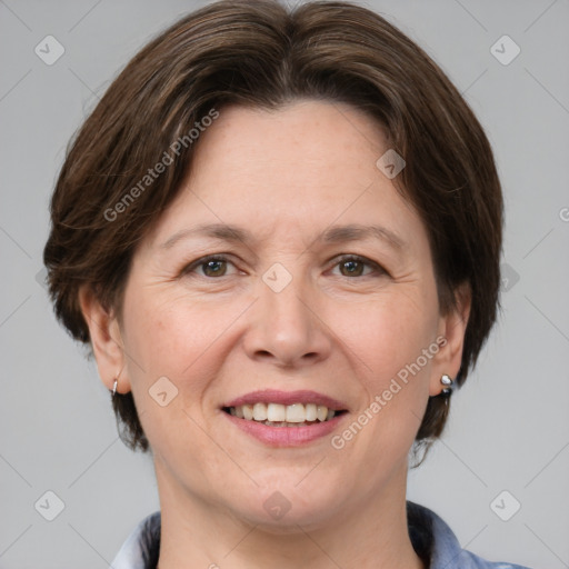 Joyful white adult female with medium  brown hair and grey eyes