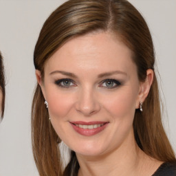 Joyful white young-adult female with medium  brown hair and blue eyes