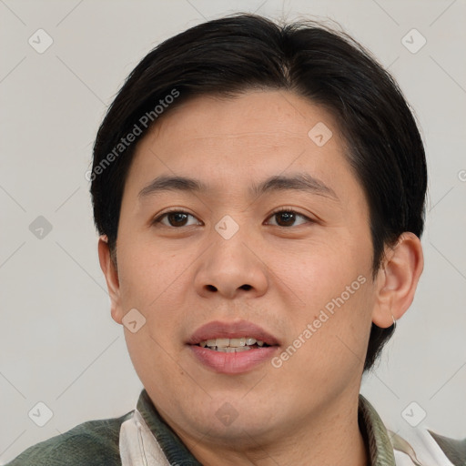 Joyful asian young-adult male with short  brown hair and brown eyes